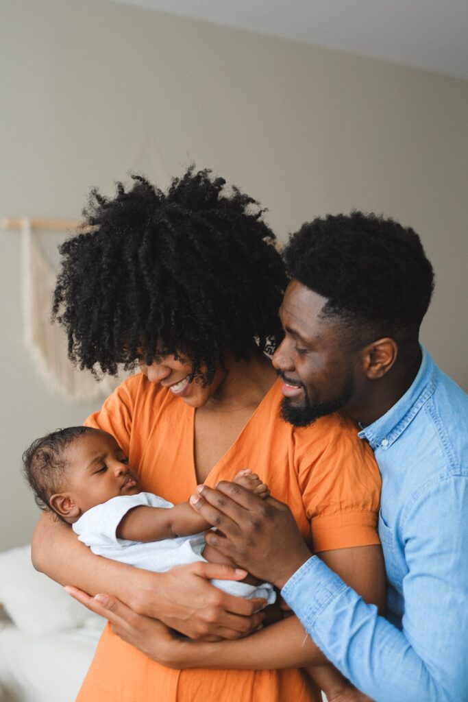 Parents holding a baby.